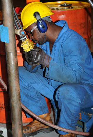 Checking for repairs needed during an engine overhaul.